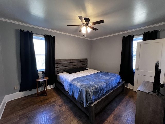 bedroom with dark wood finished floors, baseboards, and ornamental molding