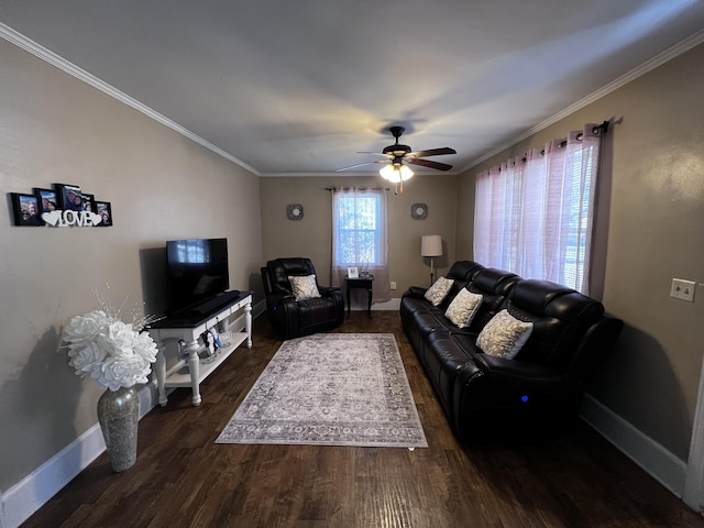 living area with dark wood finished floors, crown molding, a ceiling fan, and baseboards