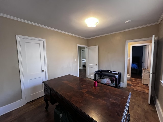 office space featuring dark wood finished floors, crown molding, and baseboards