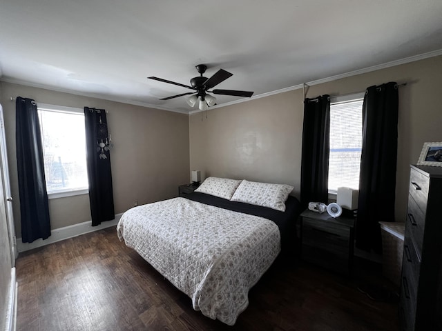 bedroom with baseboards, crown molding, a ceiling fan, and dark wood-style flooring