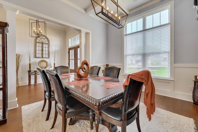 dining room featuring beamed ceiling, hardwood / wood-style flooring, and crown molding