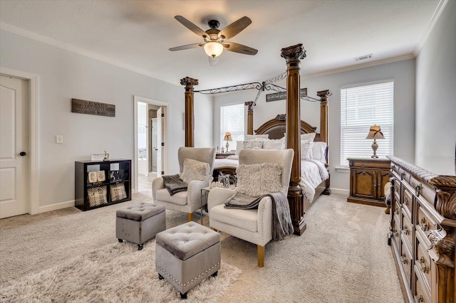 carpeted bedroom with ensuite bath, ceiling fan, and ornamental molding