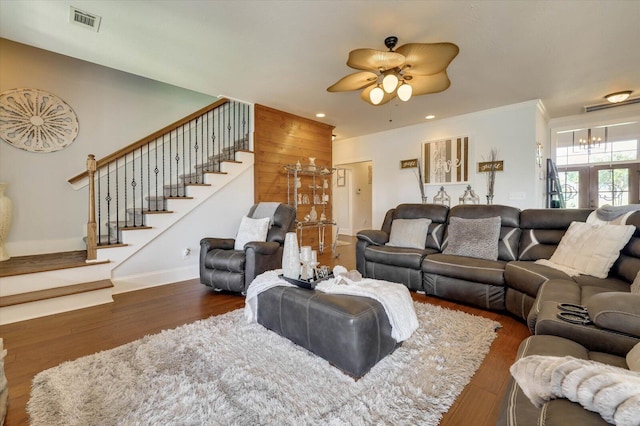 living room featuring ceiling fan, dark hardwood / wood-style flooring, and ornamental molding