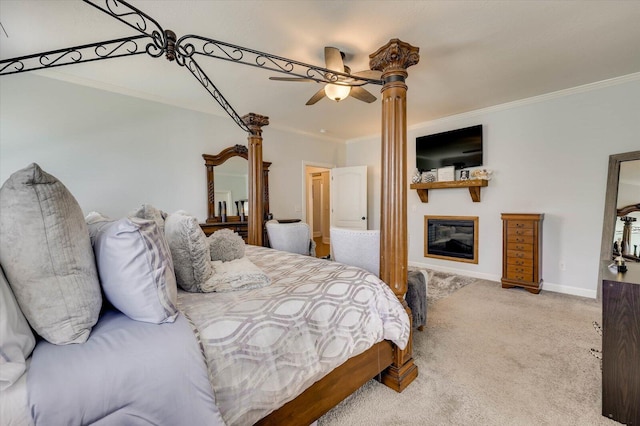 carpeted bedroom featuring ceiling fan and ornamental molding