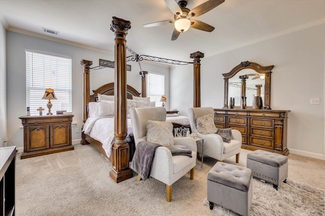 carpeted bedroom with multiple windows, ceiling fan, and ornamental molding