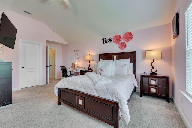 bedroom with ceiling fan, light carpet, and vaulted ceiling