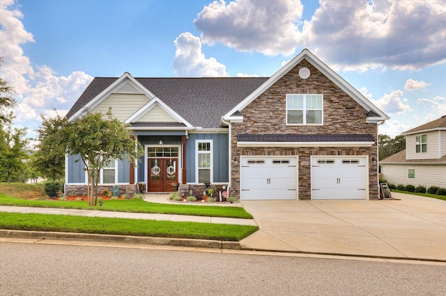 craftsman-style home featuring french doors and a garage