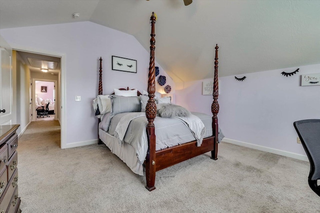 carpeted bedroom featuring lofted ceiling