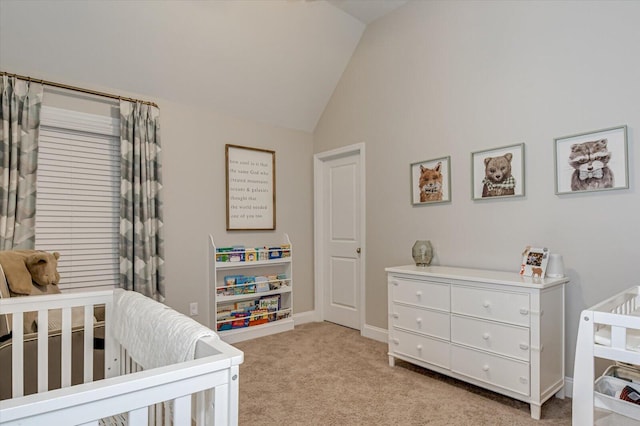 carpeted bedroom with vaulted ceiling