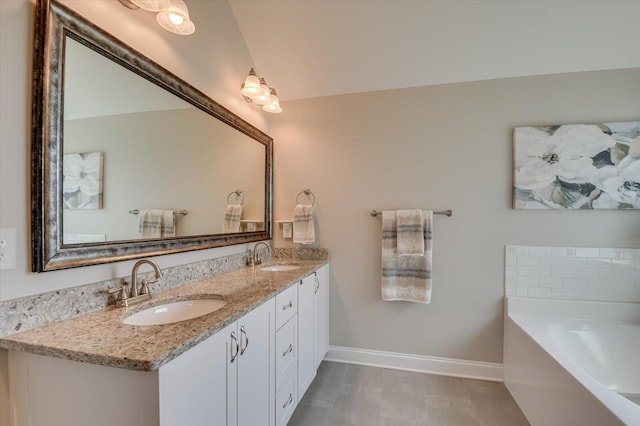 bathroom with vanity and a bathtub