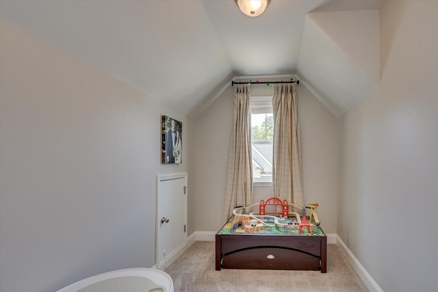 interior space featuring light carpet and lofted ceiling