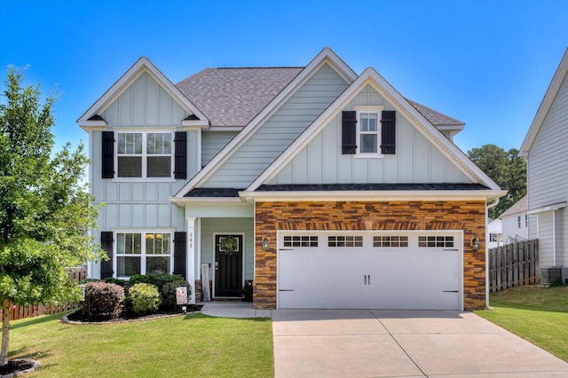 craftsman-style house featuring a garage, a front lawn, and cooling unit