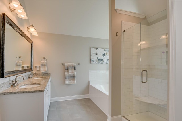 bathroom featuring tile patterned floors, vanity, and plus walk in shower