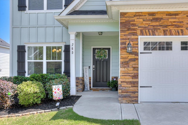 doorway to property featuring a garage