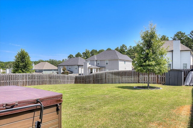 view of yard with a hot tub