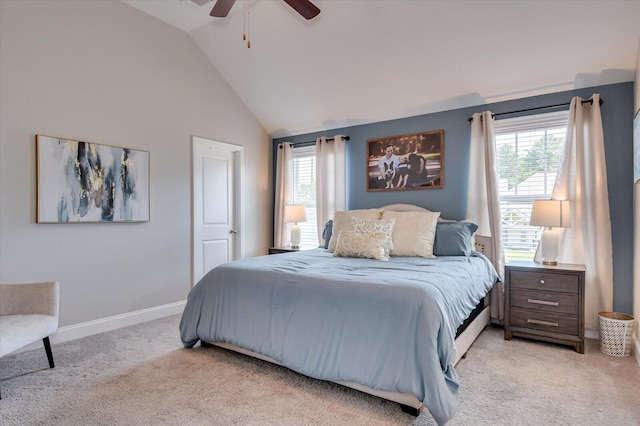 bedroom with multiple windows, light carpet, vaulted ceiling, and ceiling fan