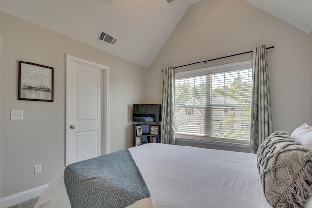 bedroom featuring carpet and lofted ceiling