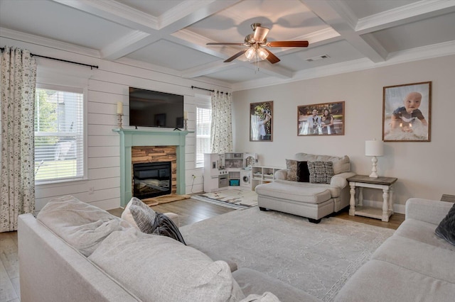 living room with beamed ceiling, light wood-type flooring, and coffered ceiling