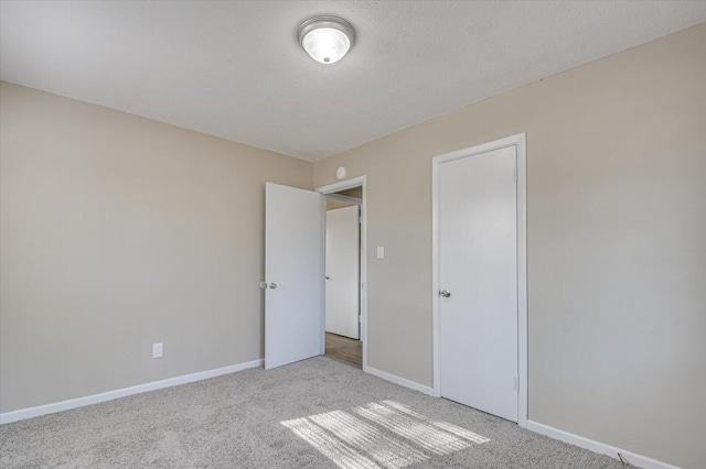 unfurnished bedroom with light carpet