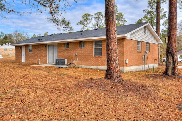 rear view of property featuring cooling unit