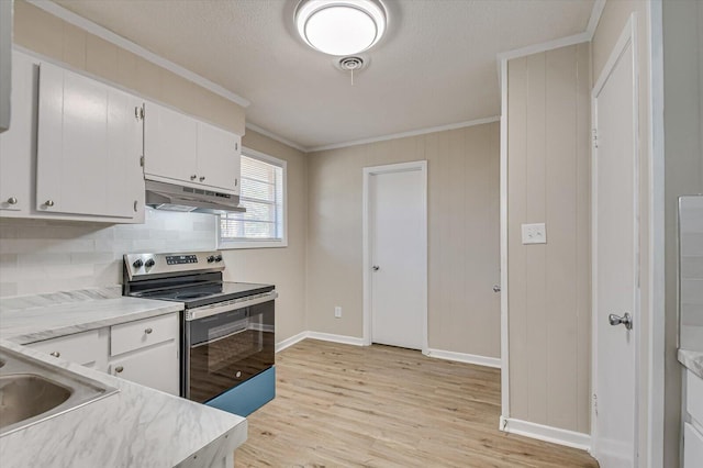 kitchen with white cabinets, light hardwood / wood-style flooring, crown molding, and stainless steel range with electric stovetop