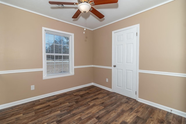 unfurnished room featuring dark wood-type flooring, ceiling fan, and ornamental molding