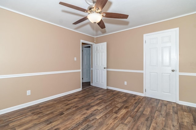 unfurnished bedroom featuring ornamental molding, dark hardwood / wood-style floors, and ceiling fan