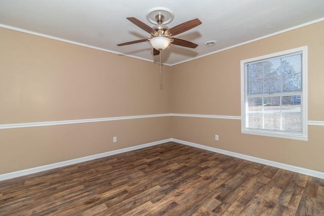 spare room featuring ornamental molding, dark hardwood / wood-style floors, and ceiling fan