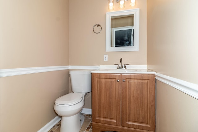 bathroom with vanity, toilet, and tile patterned flooring