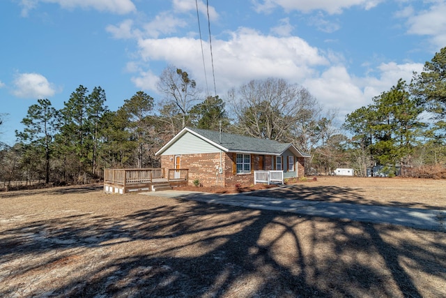 view of property exterior with a deck