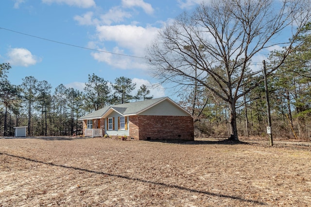 view of side of property with covered porch