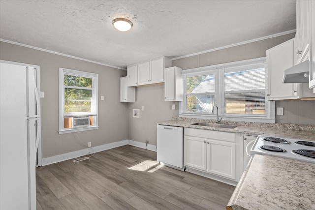 kitchen featuring a wealth of natural light, white cabinetry, sink, white appliances, and ornamental molding