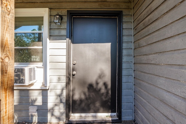 property entrance with cooling unit