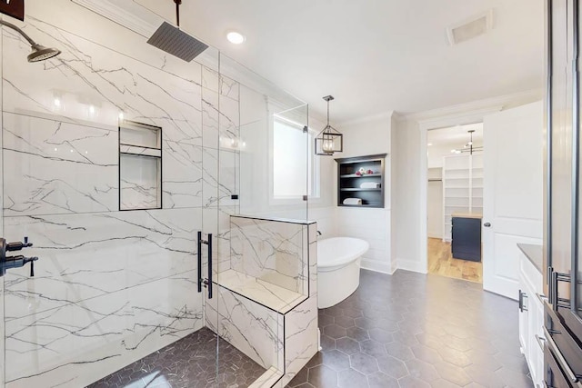 full bath with tile walls, visible vents, a soaking tub, a marble finish shower, and crown molding