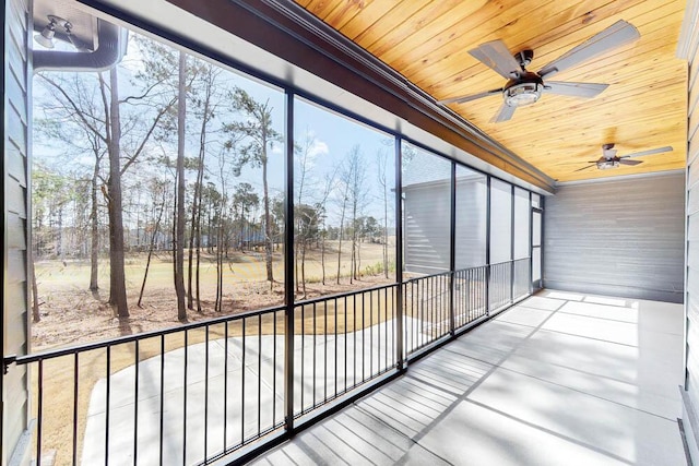 unfurnished sunroom with a wealth of natural light and wood ceiling