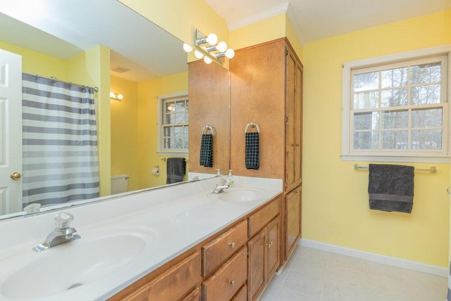 bathroom with tile patterned floors, vanity, and toilet