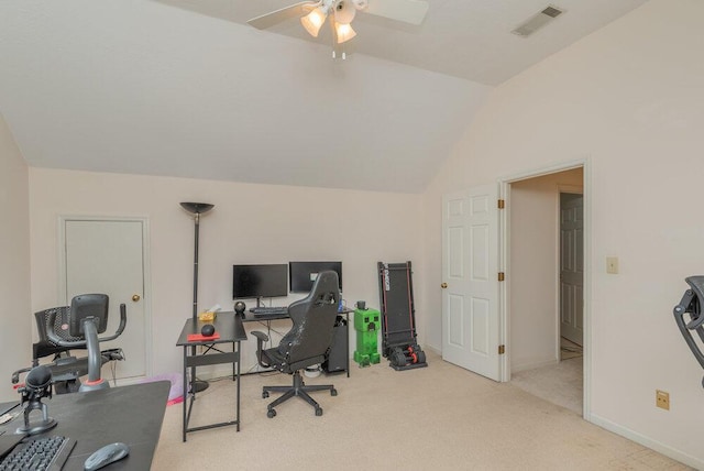 carpeted home office with vaulted ceiling and ceiling fan