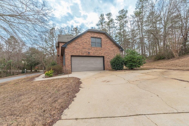 view of side of property with a garage