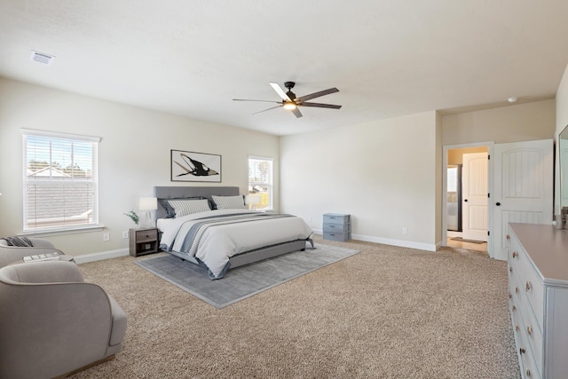 bedroom featuring light carpet, a ceiling fan, visible vents, and baseboards