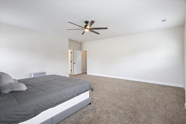 bedroom with carpet floors, visible vents, baseboards, and a ceiling fan