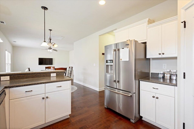 kitchen featuring dark countertops, high end refrigerator, white cabinets, and dark wood-type flooring