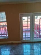 doorway featuring french doors and ornamental molding