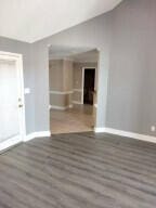 empty room with dark hardwood / wood-style floors