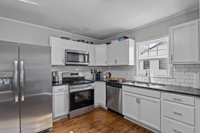 102 Oak St, Washington, GA 30673 - kitchen with a sink, tasteful backsplash, appliances with stainless steel finishes, and crown molding