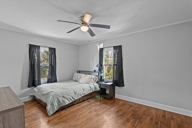 102 Oak St, Washington, GA 30673 - bedroom with visible vents, ornamental molding, baseboards, and wood-type flooring