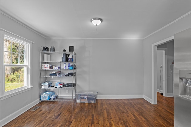 102 Oak St, Washington, GA 30673 - empty room with visible vents, wood finished floors, baseboards, and ornamental molding