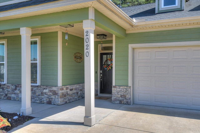 2020 Sinclair Dr, Grovetown, GA 30813 - entrance to property with stone siding, covered porch, driveway, and roof with shingles