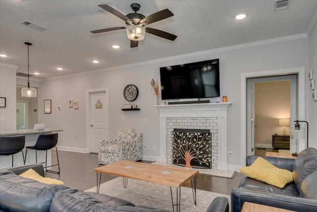 2020 Sinclair Dr, Grovetown, GA 30813 - living room featuring ceiling fan, crown molding, recessed lighting, baseboards, and a brick fireplace