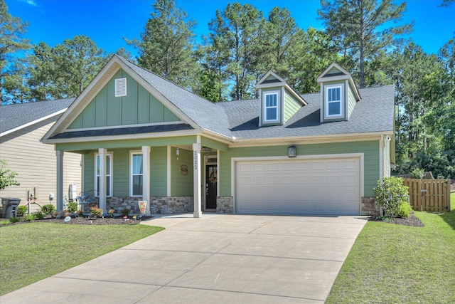 2020 Sinclair Dr, Grovetown, GA 30813 - view of front facade featuring stone siding, board and batten siding, concrete driveway, a garage, and a shingled roof