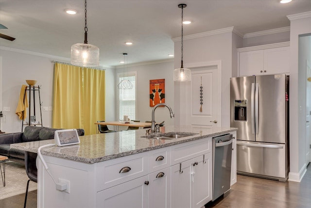 2020 Sinclair Dr, Grovetown, GA 30813 - kitchen featuring appliances with stainless steel finishes, a sink, dark wood-type flooring, an island with sink, and a kitchen bar